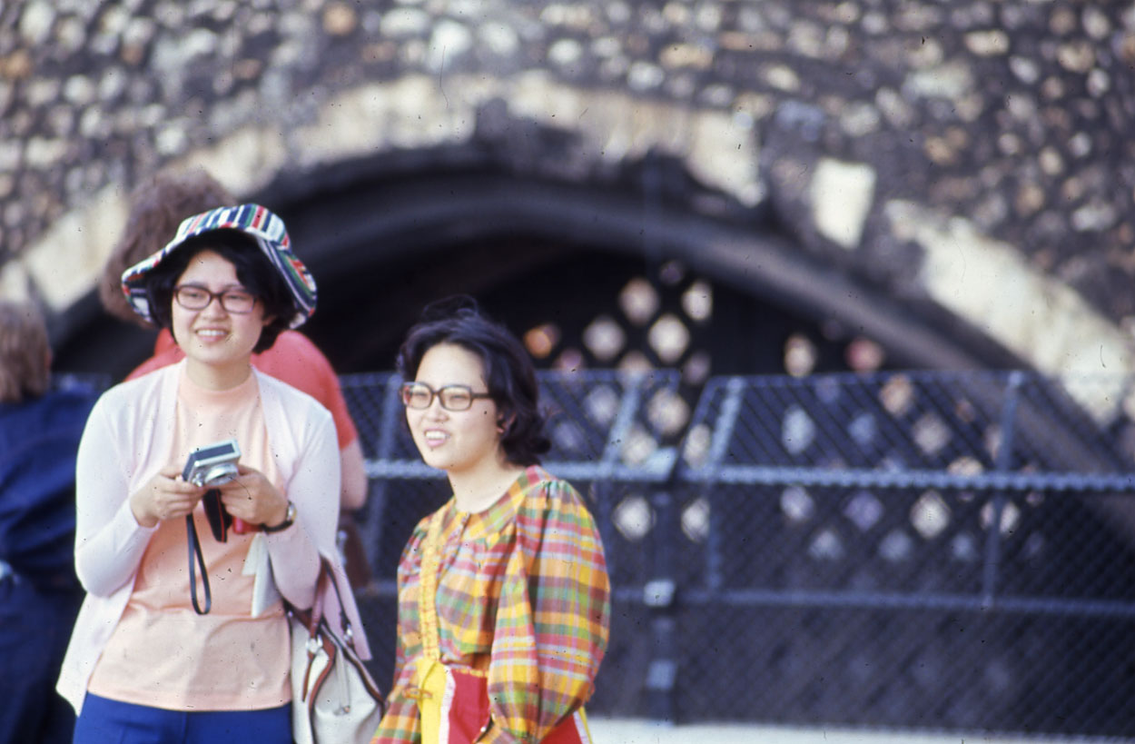 Chinese tourist with camera in London.